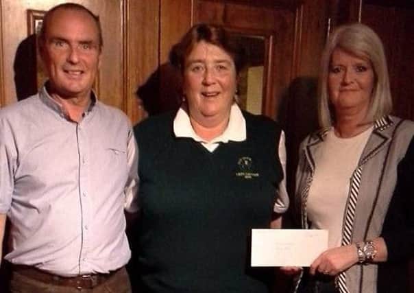 Roe Park Ladies Captain Karen Brown pictured (centre) with the winners of the Mixed Open Greensomes on Sunday, Vice-Captain Arnold Simpson and playing partner Estelle Rose.