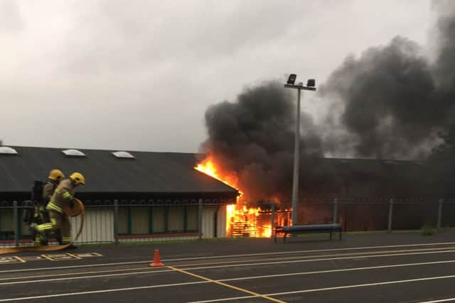 Firefighters tackle the fire at Good Shepherd Primary School.