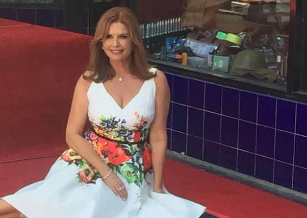 Roma Downey with her star on Hollywood Boulevard.