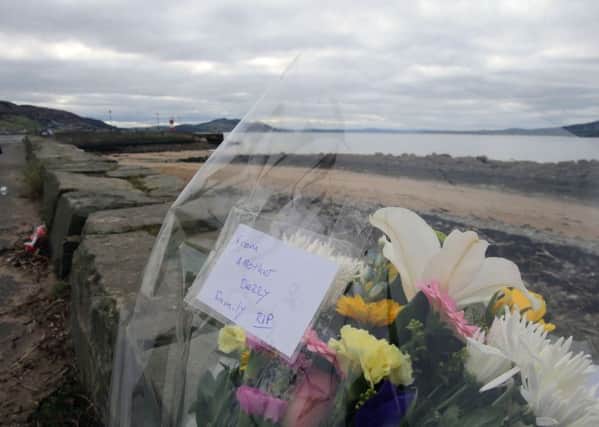 Flowers left at the scene at Buncrana Pierin the days following of the tragedy. (Niall Carson/PA Wire)