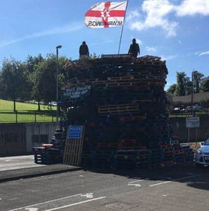 The bonfire in the heart of the Bogside being constructed on Monday morning.