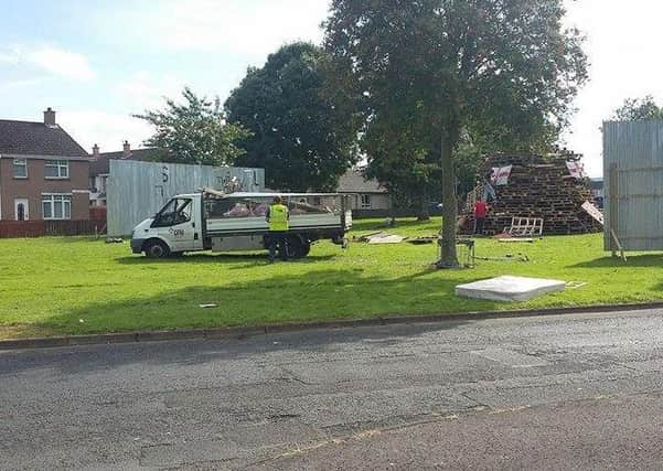 The bonfire in the Glens estate on Monday and the barriers erected by the Housing Executive.
