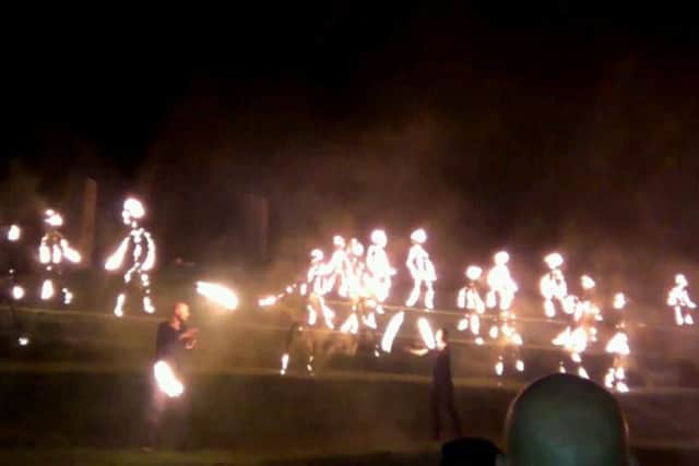 Two fire artists pictured in front of the Children of Fire at the Gasyard Feile Finale.
