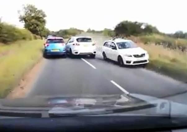 The moment a Porsche just about avoided a head-on collision.