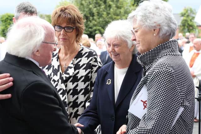 Betty Doherty shakes hands with Irish President Michael D. Higgins at Bishop Dalys funeral. Photo Lorcan Doherty/Press Eye