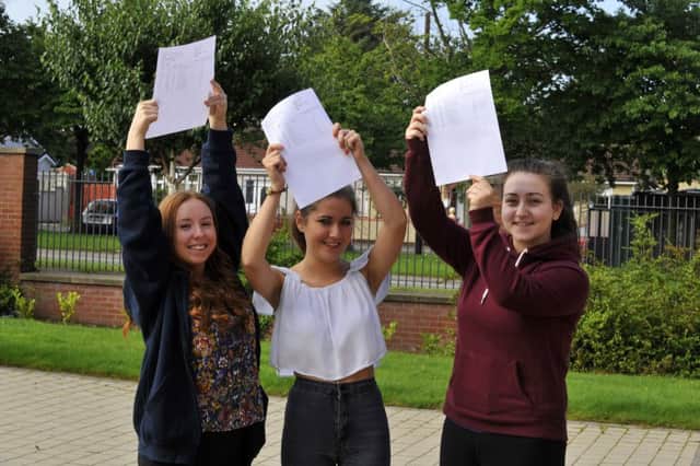 Emma Whoriskey (left), Rebecca McAllister and Erin Coyle celebrate their A Level results at St Mary's College, Derry in 2015. DERR3215GS039