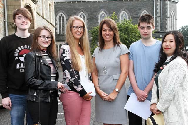 Lumen Christi College principal Mrs. Siobhan McCauley, with five students who each received 4A* levels  in their results. From left are Jack Bradley, Eva Kerr, Shannon Young, Brendan Flanagan and Ruiqi Wang.  3316-4862MT.