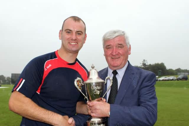 NW President Connie McAllister presents O'Neills Ulster Cup trophy to Andy Britton after Brigade beat Ardmore 3-2 in a bowl out. (
Picture Barry Chambers / Press Eye)