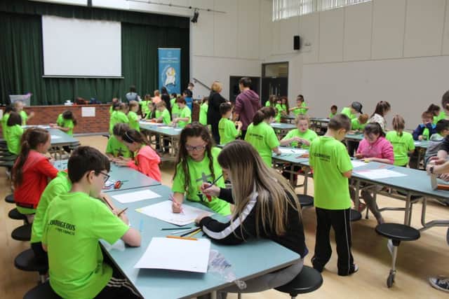 Children getting involved in arts and crafts during the camp.