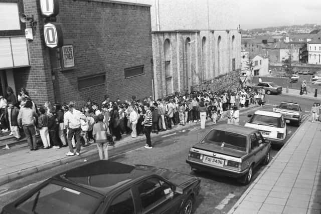 Hundreds of people queue outside the Rialto at the opening of the Children's Film Bonanza.