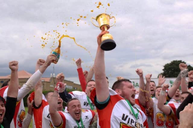 The Derry Donegal Vipers celebrate after winning the  IAFL2  trophy.