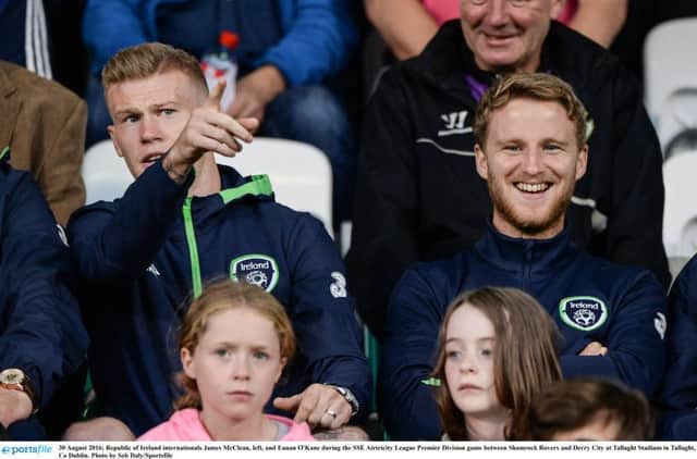 Eunan O'Kane, on right, pictured watching Derry City's league clash against Shamrock Rovers with James McClean last Tuesday night, is delighted to make his move to Leeds United.