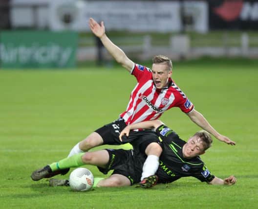 Derry City's Ronan Curtis with Conor Melody of Galway United at the Brandywell on Friday night. Picture by Margaret McLaughlin.