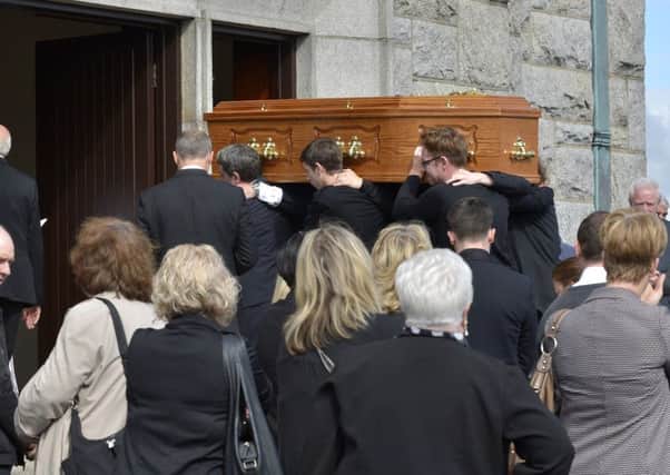 The coffin of Tony Griffiths is carried into St Mary's Church Creggan on Sunday last for Requiem Mass. DER3616GS002