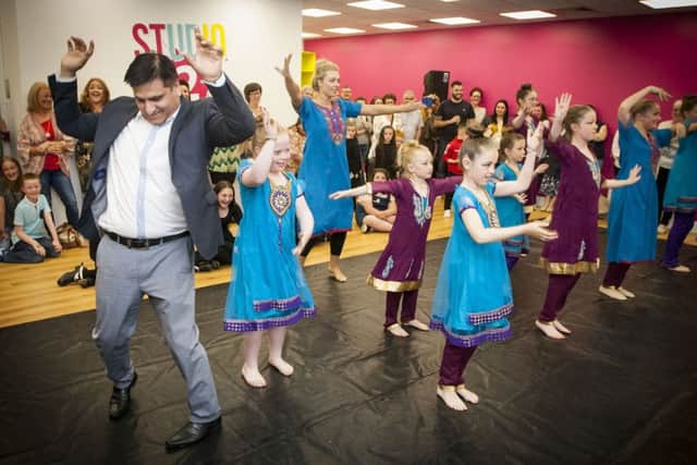 Contribution to Arts and Culture award winner, Dr. Mukesh Chugh joins in on the dance routine with Irena Noonan and her Streetfeet dancers.