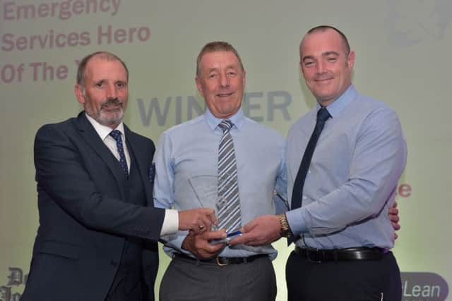 Emergency Services Hero of the Year  Sammy Nicholl receives the award from Arthur Duffy editor Derry Journal and Joseph Merrigan Lisnagelvin Shopping Centre at the Derry Journal People of the Year Awards in the Everglades Hotel Derry on Thursday evening last. DER3616GS058