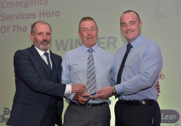 Emergency Services Hero of the Year  Sammy Nicholl receives the award from Arthur Duffy editor Derry Journal and Joseph Merrigan Lisnagelvin Shopping Centre at the Derry Journal People of the Year Awards in the Everglades Hotel Derry on Thursday evening last. DER3616GS058