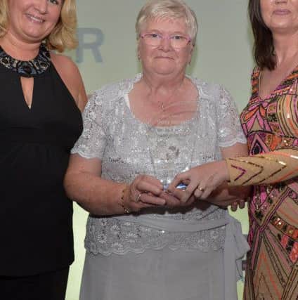 Margaret Sloan receiving the award Community Development Person of the Year posthumously awarded to Mona McConnell from Tracey McCloskey APEX  and the Derry Journals Louise Strain at the Derry Journal People of the Year Awards in the Everglades Hotel Derry on Thursday evening last. DER3616GS050