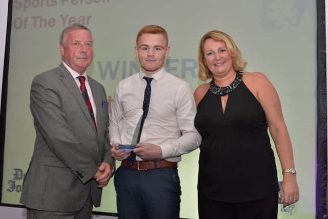 Sports Person of the Year Bret McGinty receives the award from Deric Henderson representing associate sponsor A McLean Bookmakers and Andrena OPrey from Johnston Press at the Derry Journal People of the Year Awards in the Everglades Hotel Derry on Thursday evening last. DER3616GS054