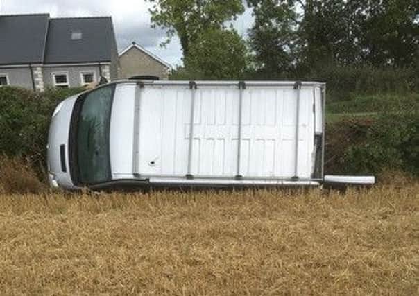 The van landed on its side and in a field.