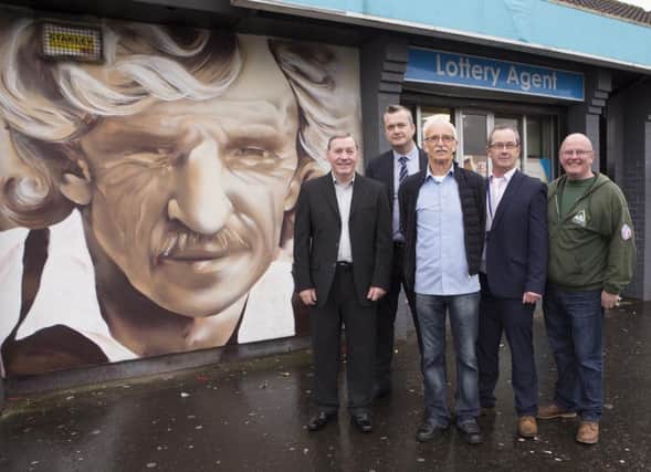 Creggan sporting heroes, Charlie Nash (boxer) and Tony O'Doherty (footballer), pictured at the unveiling of a series of new murals to celebrate Creggan sports stars at the Creggan shops. Also included is Ken Breslin, area manager, NI Housing Executive, Kevin Campbell, Triax Neighbourhood Management Team, and Eddie Breslin, good relations officer, NI Housing Executive.