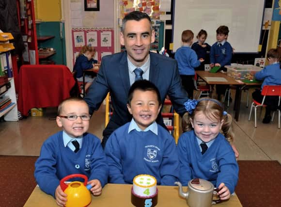 Mr Antoin Moran newly appointed principal of Nazareth House Primary School pictured with P1 pupils Henry Hutcheon, Oscar Layberry-Ling and Sophia Johnston. DER3716GS022