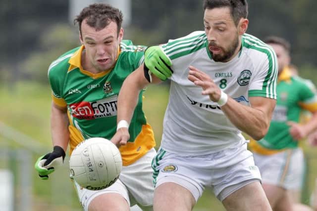 Foreglen's Cathal O'Hara with Adrian McLaughlin of Craigbane in the Derry Intermediate Championship match at Owenbeg on Saturday. (Picture: Margaret McLaughlin)