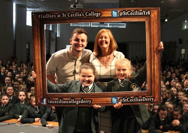 X Factor's Conor McGinty woos the staff and students at St Cecilia's College on Friday morning.