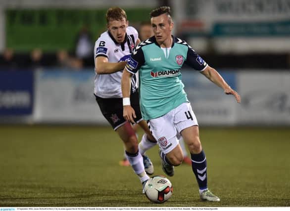 FRUSTRATED . . .  Aaron McEneff of Derry City in action against David McMillan of Dundalk.