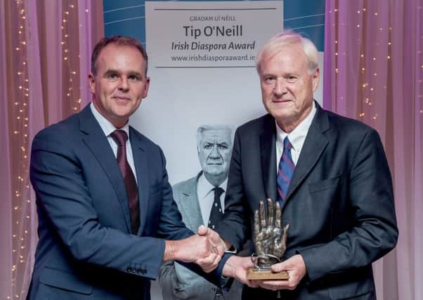 Donegal Fine Gael TD Joe McHugh, Minister of State at the Department of Arts, Heritage and Gaeltacht Affairs, congratulates Us broadcaster Chris Matthews as he receives the Tip O'Neill Irish Diaspora Award at the Inishowen Gateway hotel in Buncrana on Friday night. (Photographer: Paul McGuckin)