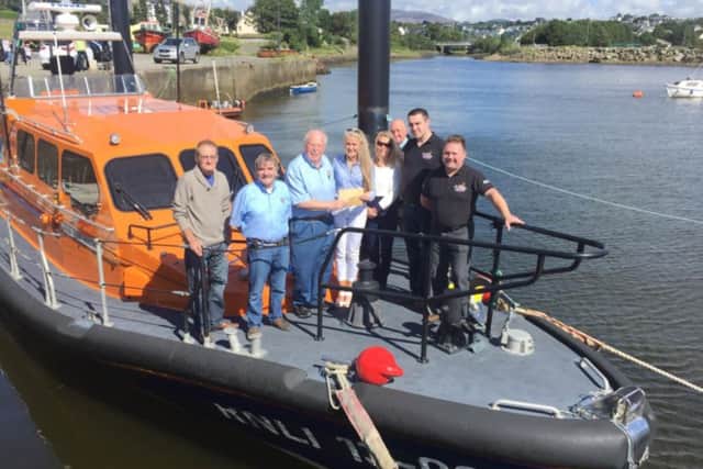 Stephanie Knox and her family with crew of Lough Swilly RNLI