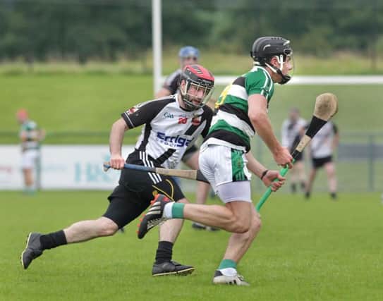 Kevin Lynch's Ciaran Mackle chases Blaidhan Glass of Na Magha during August's Derry SHC quarter final match. (Picture Margaret McLaughlin)