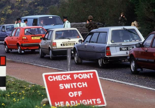 RUC and army checking cars at the border in the 1980s. (Pacemaker)