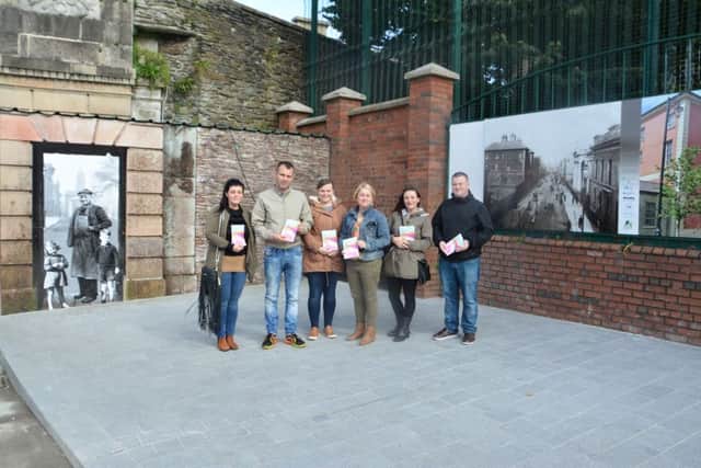 Project leaders with a new pamphlet for a tourist treasure hunt through the Fountain/ Bishop Street, available at the Tourist Office.