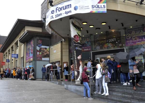 The scene outside the Millennium Forum for last year's Jobs Fair as people queue to talk to prospective employers. DER3815GS042