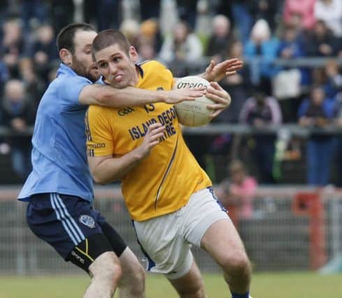 A high challenge on Coalisland's Brian Toner from Mat Swift during the Tyrone Senior Championship final.