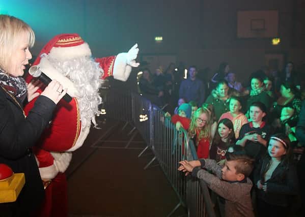 Michelle Knight-McQuillan the Mayor of the Causeway Coast and Glens Borough Council with Santa Claus at the Christmas lights switch on in Dungiven on Saturday night. INLV4915-134KDR