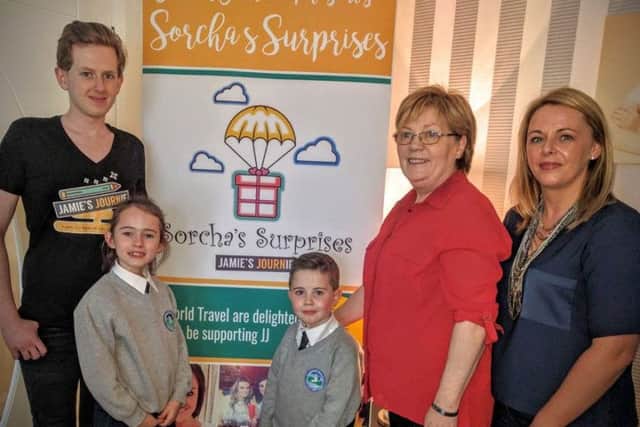 Jamie, pictured with his sister Grace and Rory Hutcheon (the first recipientsof Sorchas Surprises), Christina Glenn (Sorcha's mum) and Denise Logue from L & J World Travel who will be supporting SS by working with the families to cater to their specific requirements.