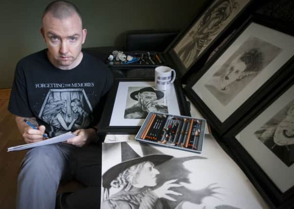 Derry artist Shaun McIntyre pictured at his Coshowen home this week working on his latest piece for the Hallowe'en exhibition 'The Haunted Pencil' which will be held in the Garden of Reflection, Derry.
