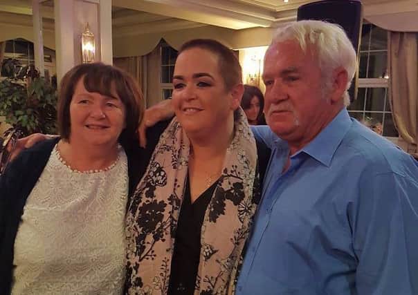 Dympna and Jerry Canning with their daughter, Angela after she had her head shaved for charity.