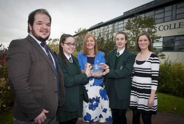 CHORAL FESTIVAL. . . . .Martine Mulhern, Principal, St. CeciliaÃ¢Â¬"s College pictured with the Unison 12-Part Competition Trophy, won by the School Choir at the City of Derry International Choral Festlival last weekend. Included are Chris Kerrigan, Conductor, students Megan Gillespie and Niamh McGonagle, and Claire McGirr, Choral Director. (Photo: Jim McCafferty Photography)