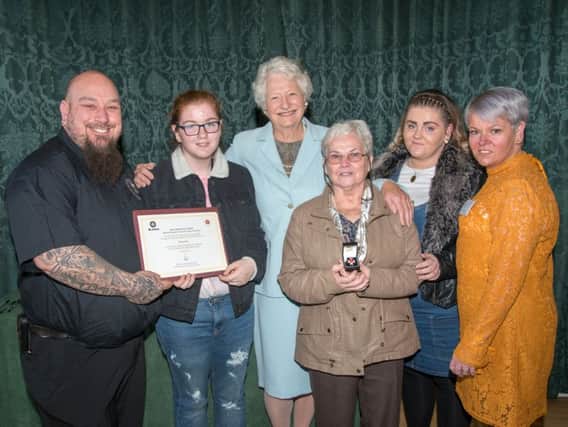 Sharon Kelly and her family receive the award given to her husband Shaun posthumously.