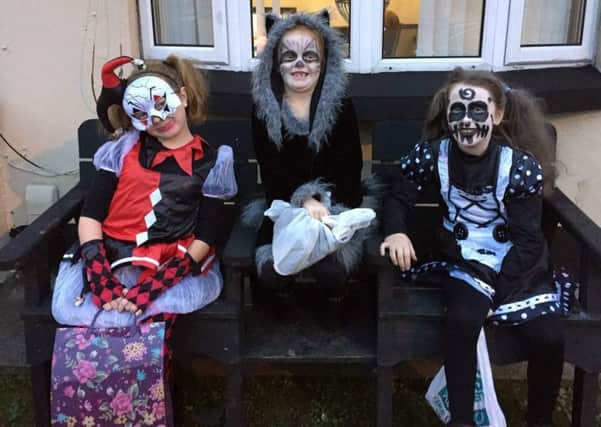 Pictured on Hallowe'en night in Derry, from left, sisters Gracie and Mara Haney from Colorado and their cousin Abaigh Wilson who is from Creggan in Derry.