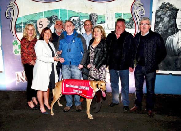 The Doire Construction A3/A4  525 winner at Lifford last Saturday night, Strafield Legend (29.18).  Mrs Eileen Gallagher  (white coat ) made the presentation to winning owner, Thomas Hagan from Stewartstown, Co. Tyrone. Others included from left, Louise Green, Kevin Daly, Tony,  Susanne Gillespie, Paul Gallagher (sponsor) and Brendan Hagan.
