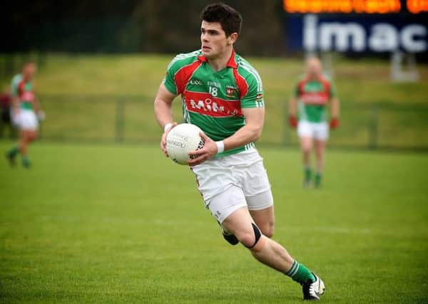 Slaughtmanus GAA player Kevin King in action against Castledawson in the 2014 Championship final at Owenbeg. Photo by Dessie Loughery