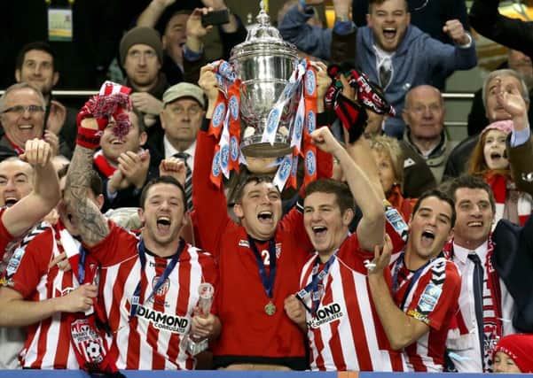Derry City captain Kevin Deery lifts the FAI Cup in the Aviva Stadium in Dublin in 2012.