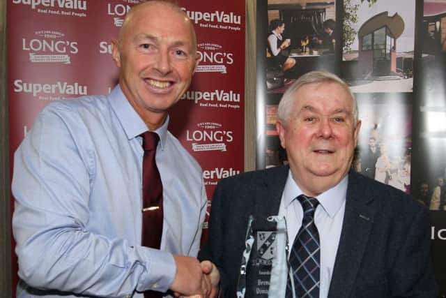 Brendan Donaghey receives his North West Cricket Hall of Fame accolade from Ardmore's Decker Curry at the annual presentation evening in the White Horse hotel.