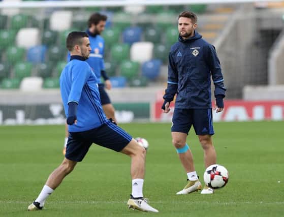 Former Derry City winger, Michael Duffy and Ollie Norwood during Northern Ireland's training session at the National Stadium ahead of tonight's World Cup Qualifier against Azerbaijan.