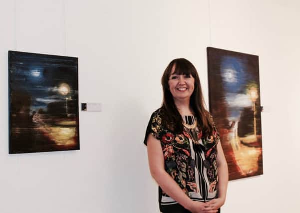 Local artist Aislinn Cassidy pictures at the launch of her exhibtion in Strabane.