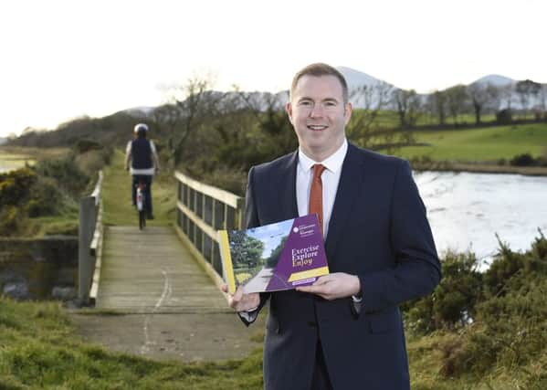 Infrastructure Minister Chris Hazzard at the old railway track near Dundrum, as he launched his plan to develop 1000kms of greenways paths across the north. Picture: Michael Cooper